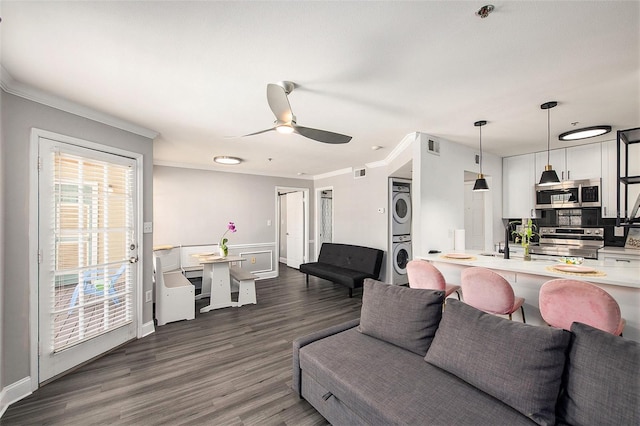 1000 W Horatio St Unit 207, Tampa, FL 33606 - living room with a ceiling fan, dark wood-style flooring, stacked washing maching and dryer, and crown molding