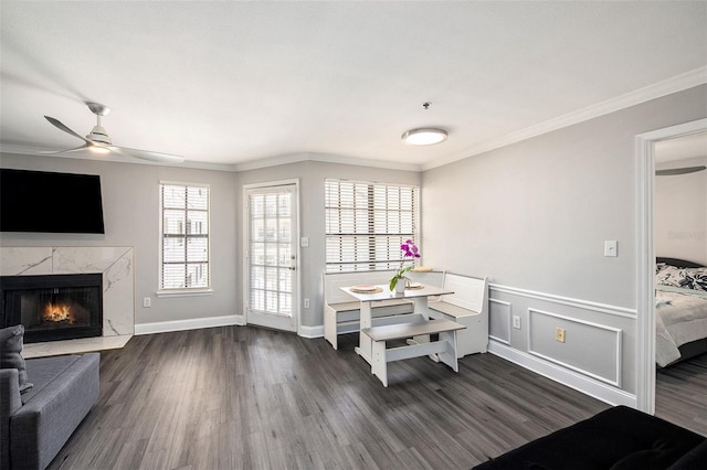 1000 W Horatio St Unit 207, Tampa, FL 33606 - dining space with a ceiling fan, ornamental molding, dark wood-type flooring, and a fireplace