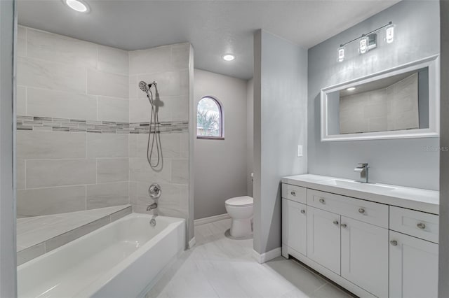 full bathroom with baseboards, marble finish floor, toilet, vanity, and shower / bathing tub combination