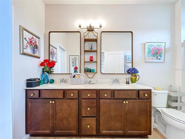 20983 Monza Loop, Land O Lakes, FL 34638 - full bathroom with double vanity and toilet