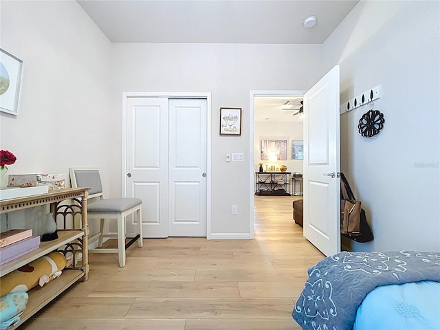 20983 Monza Loop, Land O Lakes, FL 34638 - bedroom with light wood-style floors and a closet