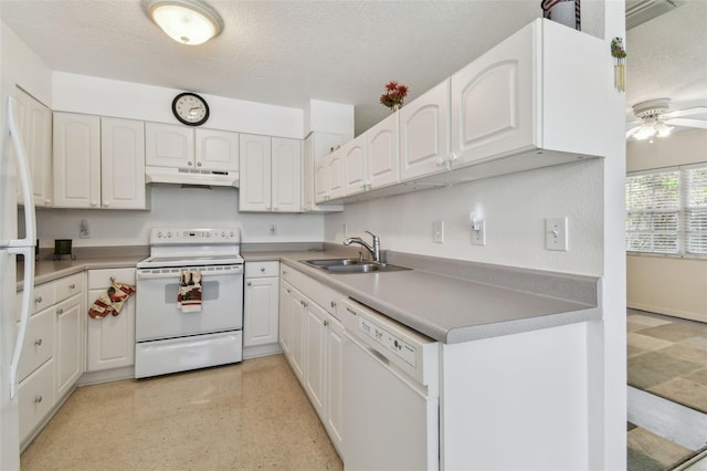 kitchen featuring white appliances, a textured ceiling, white cabinets, under cabinet range hood, and a sink