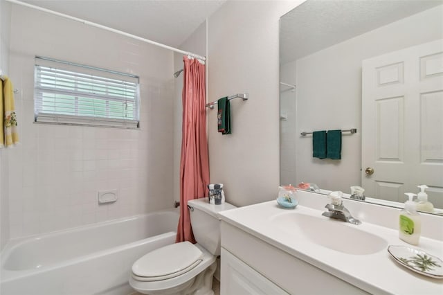 full bath featuring shower / bath combo, toilet, vanity, and a textured ceiling