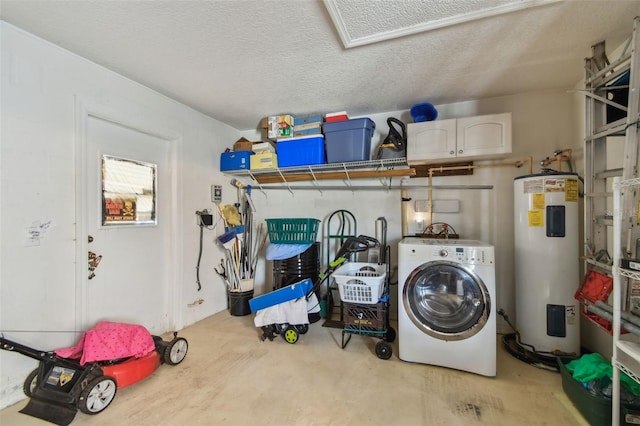 washroom with electric water heater, washer / clothes dryer, and a textured ceiling
