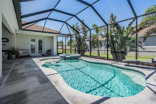 view of pool featuring fence, french doors, a patio, a lanai, and a pool with connected hot tub