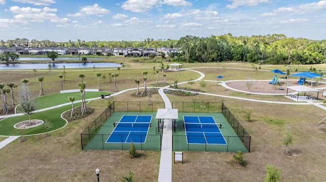 drone / aerial view featuring a residential view and a water view