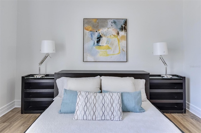 331 Cleveland St Unit 320, Clearwater, FL 33755 - bedroom featuring baseboards and wood finished floors