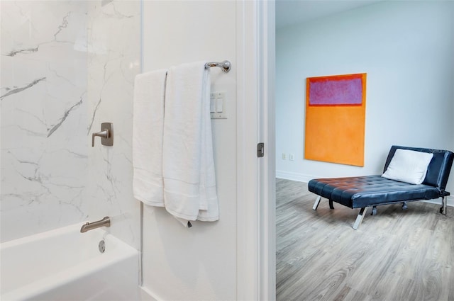 331 Cleveland St Unit 320, Clearwater, FL 33755 - full bath featuring baseboards, shower / tub combination, and wood finished floors