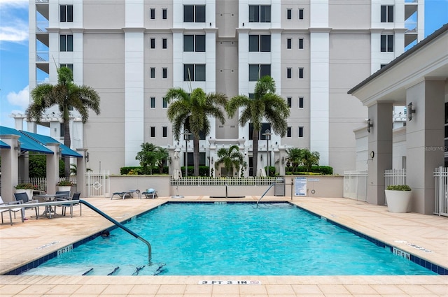 331 Cleveland St Unit 320, Clearwater, FL 33755 - community pool featuring fence and a patio area