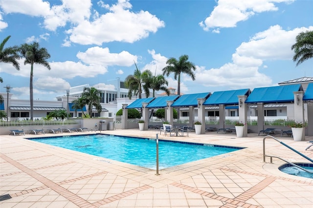 331 Cleveland St Unit 320, Clearwater, FL 33755 - pool with fence and a patio area