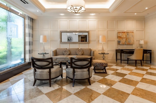 331 Cleveland St Unit 320, Clearwater, FL 33755 - living room featuring a tray ceiling, a notable chandelier, ornamental molding, and a decorative wall