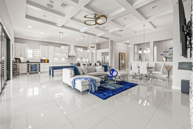 11014 Rustic Timber Loop, San Antonio, FL 33576 - living area with visible vents, beverage cooler, a chandelier, and light tile patterned floors