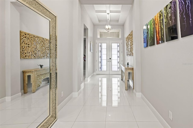 11014 Rustic Timber Loop, San Antonio, FL 33576 - hallway featuring tile patterned floors, french doors, beamed ceiling, baseboards, and coffered ceiling