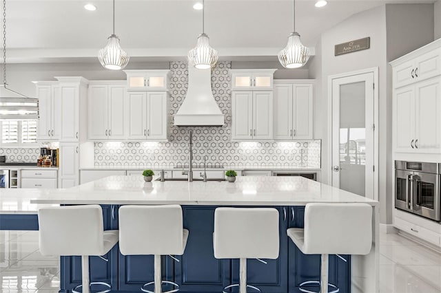 11014 Rustic Timber Loop, San Antonio, FL 33576 - kitchen featuring stainless steel oven, pendant lighting, and white cabinetry