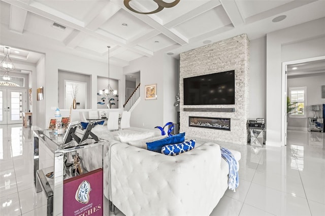 11014 Rustic Timber Loop, San Antonio, FL 33576 - tiled living room with beamed ceiling, visible vents, a fireplace, and coffered ceiling