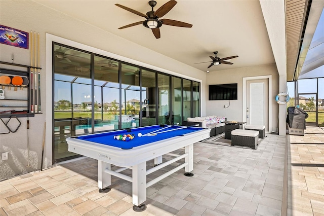11014 Rustic Timber Loop, San Antonio, FL 33576 - rec room featuring pool table, stone finish flooring, and ceiling fan