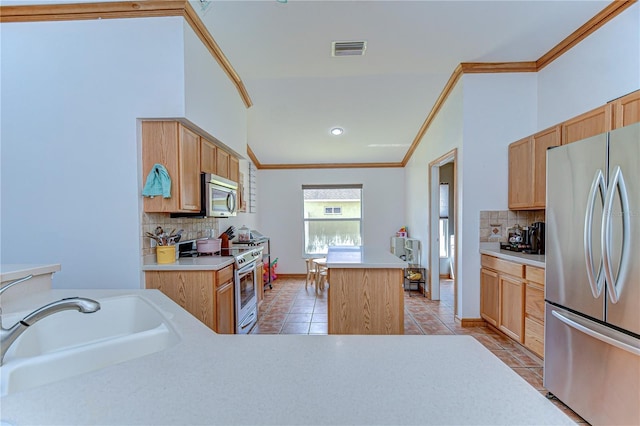 kitchen featuring light tile patterned floors, visible vents, a center island, a sink, and stainless steel appliances
