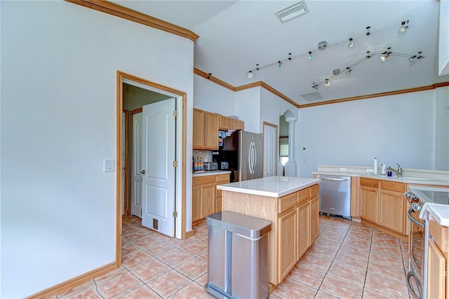 kitchen featuring light brown cabinets, light tile patterned floors, crown molding, visible vents, and appliances with stainless steel finishes