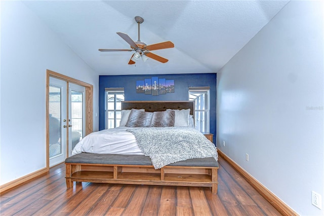 bedroom with baseboards, wood finished floors, vaulted ceiling, french doors, and access to outside