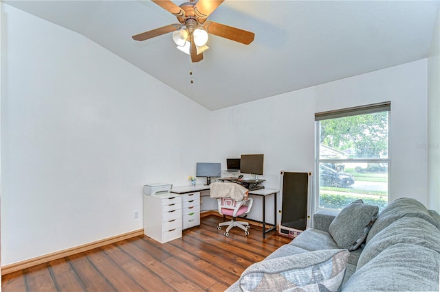 office space featuring dark wood-type flooring, ceiling fan, baseboards, and vaulted ceiling