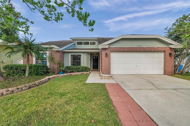 13308 Kearney Way, Tampa, FL 33626 - view of front facade featuring an attached garage, concrete driveway, a front yard, and brick siding