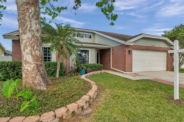 13308 Kearney Way, Tampa, FL 33626 - view of front facade featuring brick siding, driveway, a garage, and a front lawn
