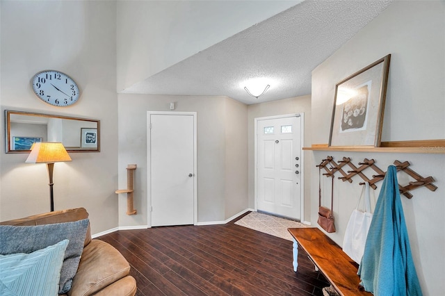 13308 Kearney Way, Tampa, FL 33626 - foyer featuring baseboards, a textured ceiling, and wood finished floors