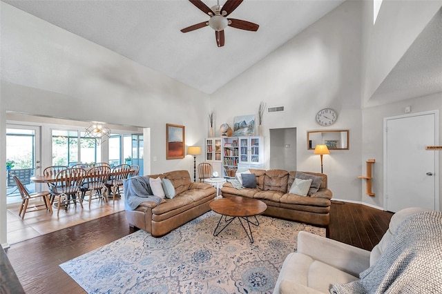 13308 Kearney Way, Tampa, FL 33626 - living room with baseboards, visible vents, ceiling fan, high vaulted ceiling, and wood finished floors