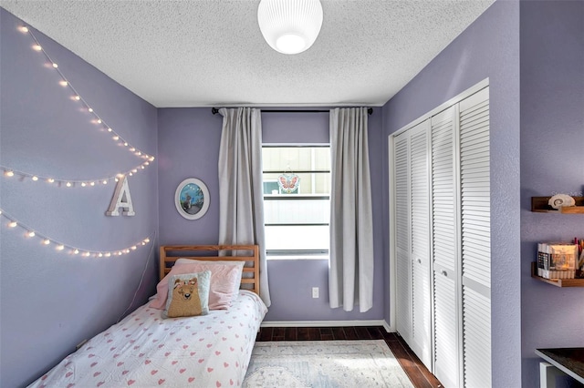 13308 Kearney Way, Tampa, FL 33626 - bedroom featuring a closet, wood finished floors, and a textured ceiling