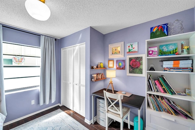 13308 Kearney Way, Tampa, FL 33626 - office area featuring baseboards, wood finished floors, and a textured ceiling