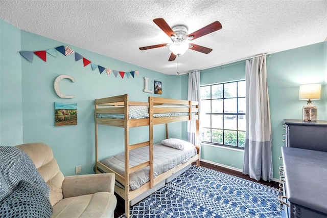 13308 Kearney Way, Tampa, FL 33626 - bedroom featuring a textured ceiling, baseboards, and a ceiling fan