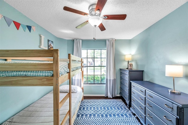 13308 Kearney Way, Tampa, FL 33626 - bedroom with a textured ceiling, baseboards, and ceiling fan