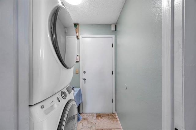 13308 Kearney Way, Tampa, FL 33626 - laundry room featuring stacked washer / dryer, laundry area, and a textured ceiling