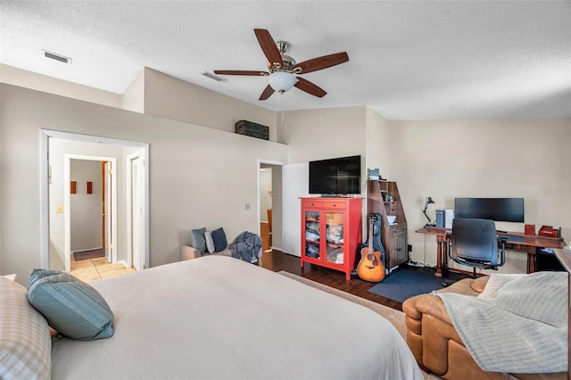 13308 Kearney Way, Tampa, FL 33626 - bedroom featuring visible vents, a textured ceiling, a ceiling fan, and wood finished floors