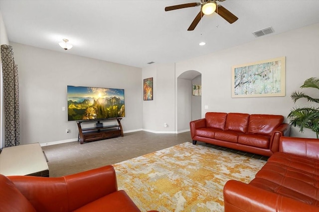 living area with ceiling fan, arched walkways, visible vents, recessed lighting, and baseboards