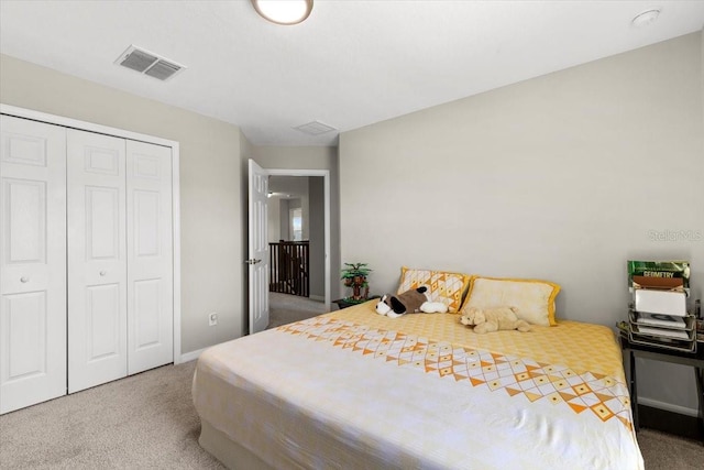 bedroom featuring visible vents, a closet, and carpet floors
