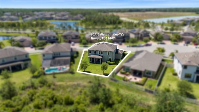 aerial view featuring a residential view and a water view