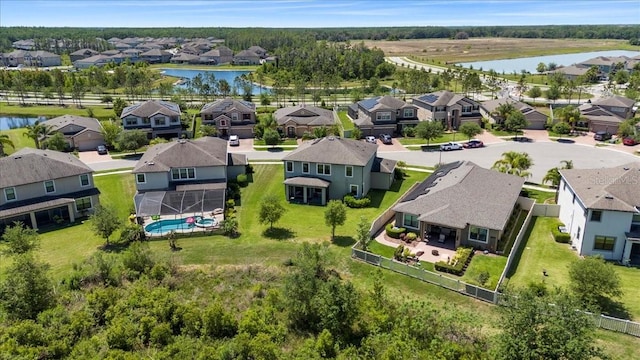 birds eye view of property with a residential view and a water view