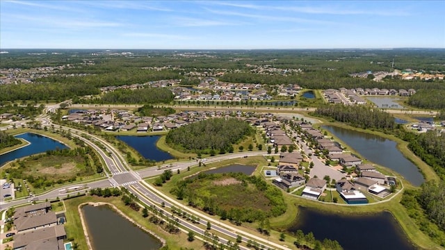 birds eye view of property with a water view and a residential view