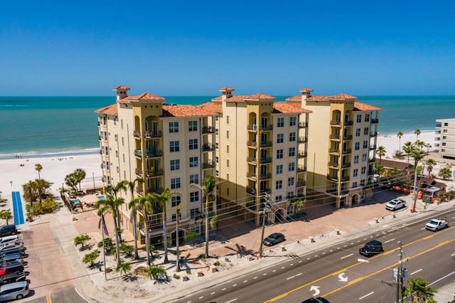 view of property featuring a water view and a view of the beach