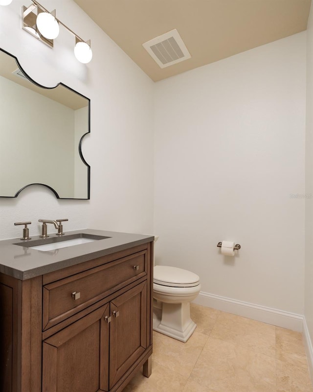 13600 Gulf Blvd Unit 700A, Saint Petersburg, FL 33708 - bathroom featuring vanity, toilet, tile patterned flooring, and baseboards