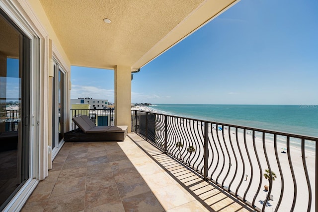 13600 Gulf Blvd Unit 700A, Saint Petersburg, FL 33708 - balcony with view of water and beach and a sunroom