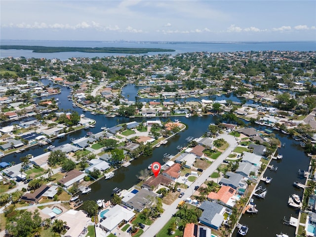 birds eye view of property with a residential view and a water view