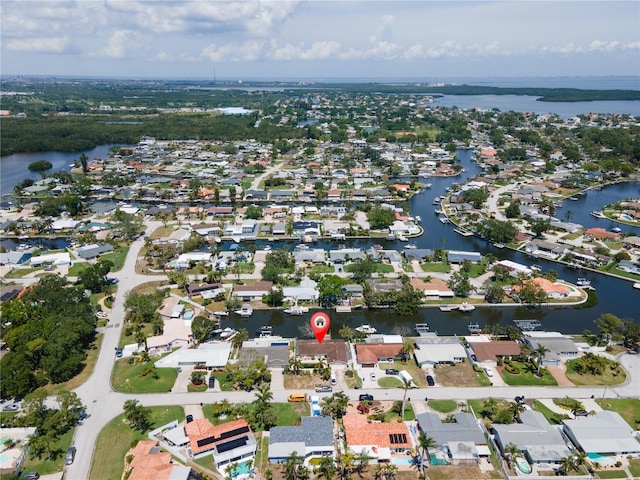 birds eye view of property featuring a water view and a residential view