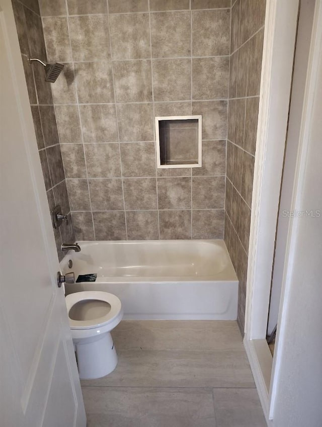 1615 Stevensons Dr, Clearwater, FL 33755 - full bathroom featuring toilet, shower / bath combination, and wood finished floors