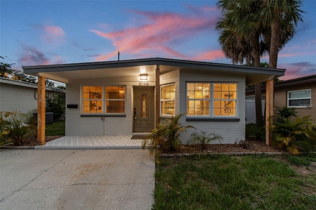 3066 Highland St N, Saint Petersburg, FL 33704 - view of front facade featuring brick siding and central AC