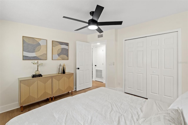3066 Highland St N, Saint Petersburg, FL 33704 - bedroom featuring wood finished floors, baseboards, a ceiling fan, and a closet