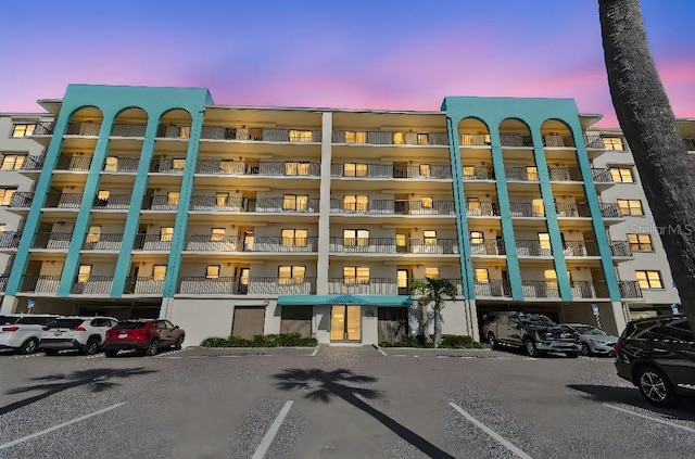 view of property featuring uncovered parking