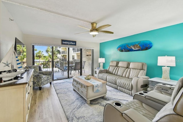 living room featuring wood finished floors and ceiling fan