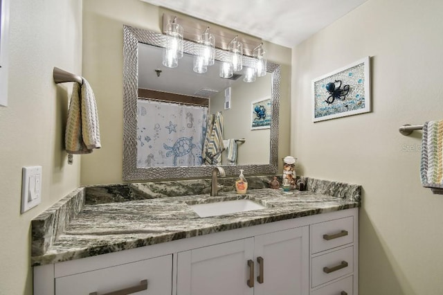 bathroom with vanity and a shower with shower curtain